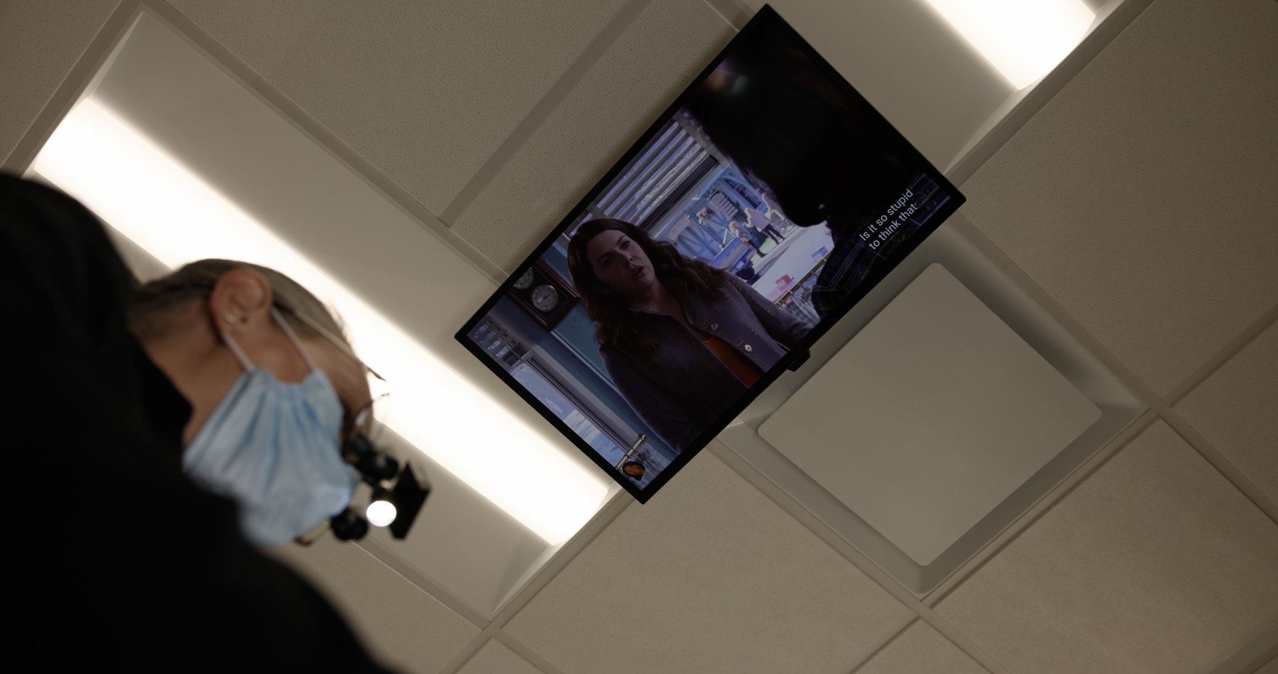 Ceiling-mounted TV for patient comfort during treatment